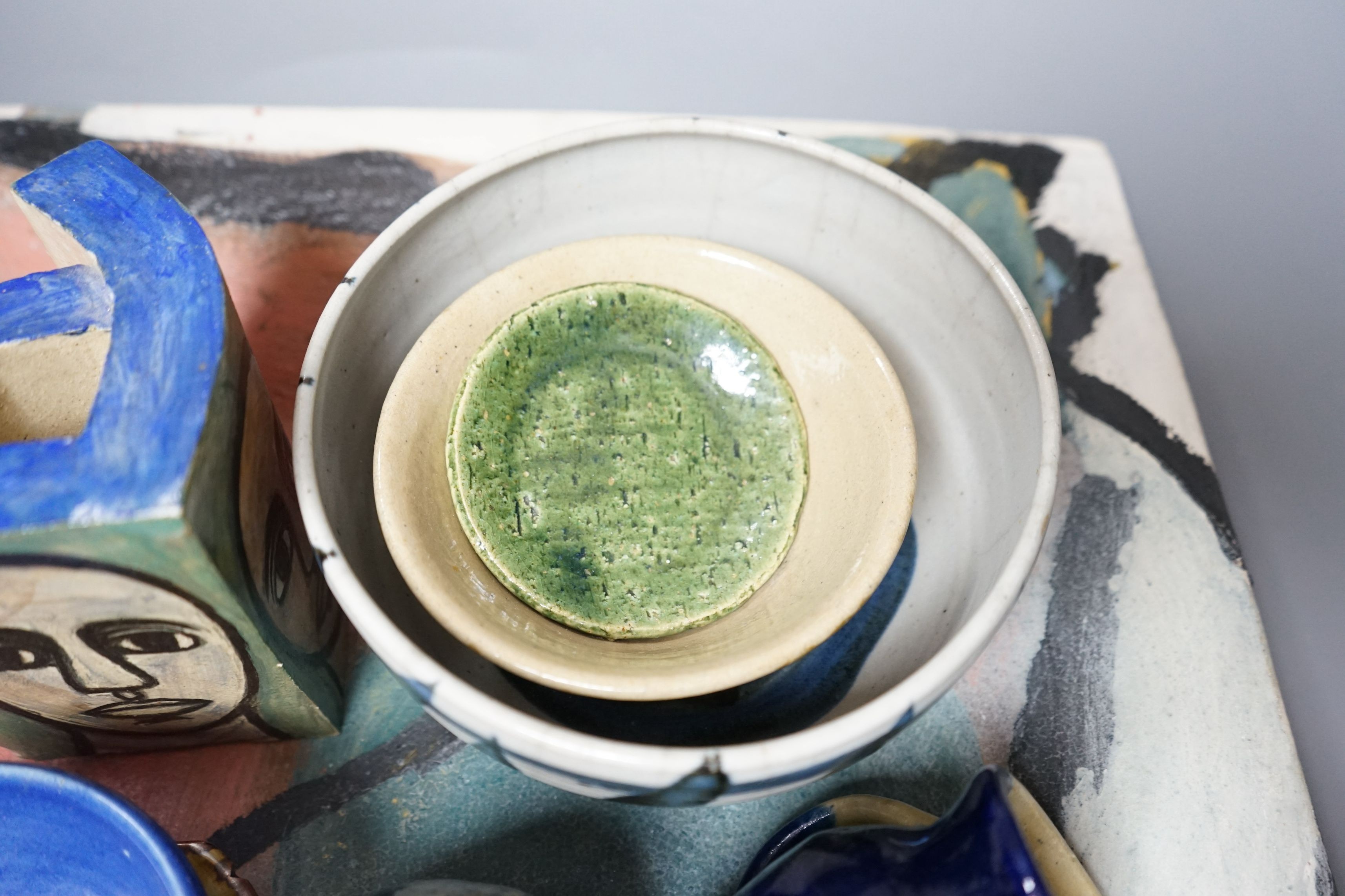 Studio pottery; a large square polychrome platter signed ‘Eastman June 87’ and a geometric vase indistinctly signed and dated 91, together with other various studio pottery wares